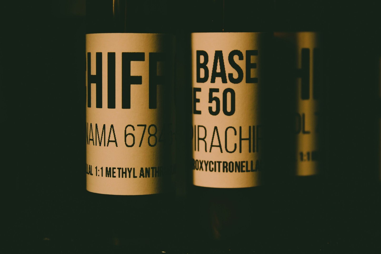 a close up of three bottles of wine